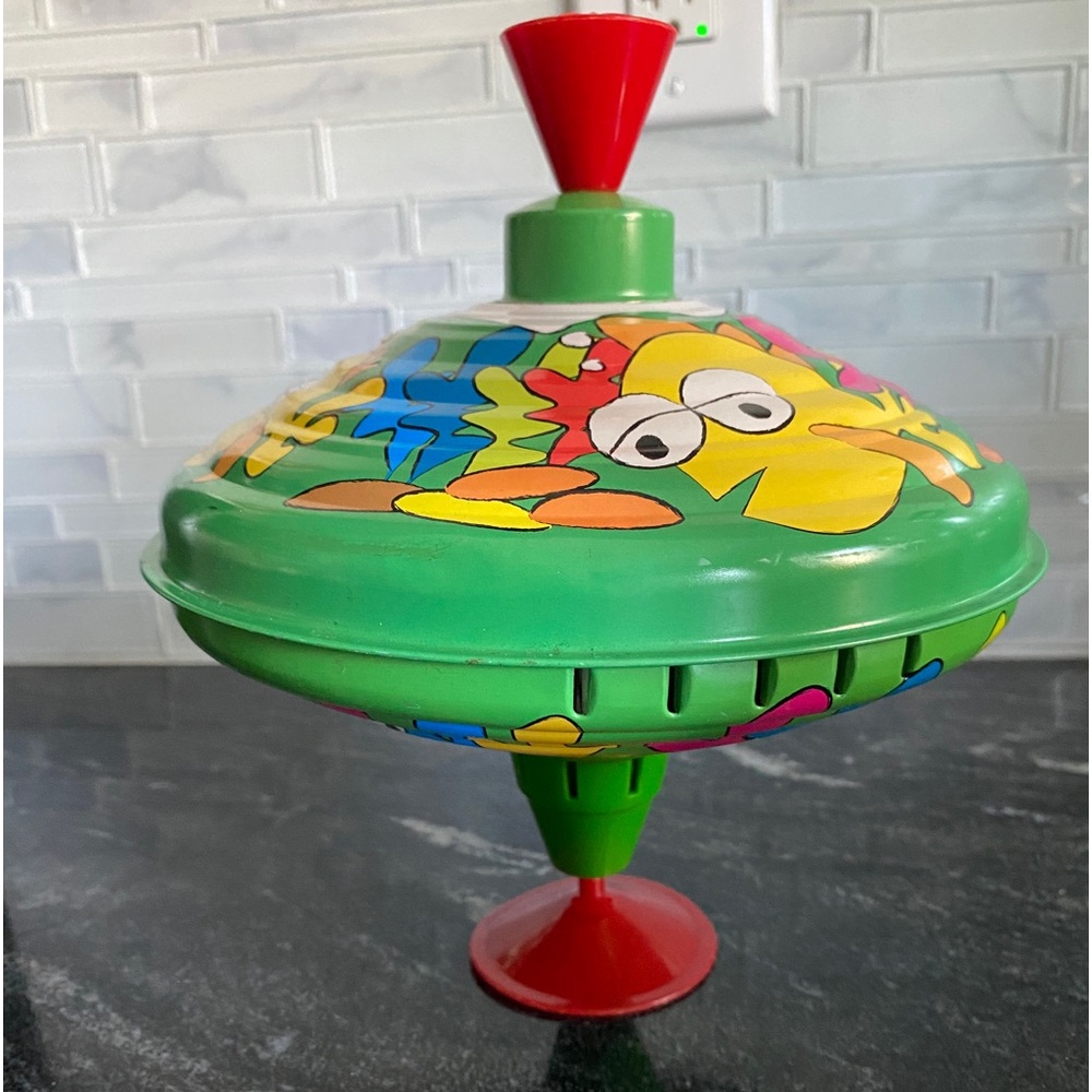 Vintage spinning top. Metal, plastic. Toy.